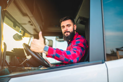 Truck driver inside of his rig